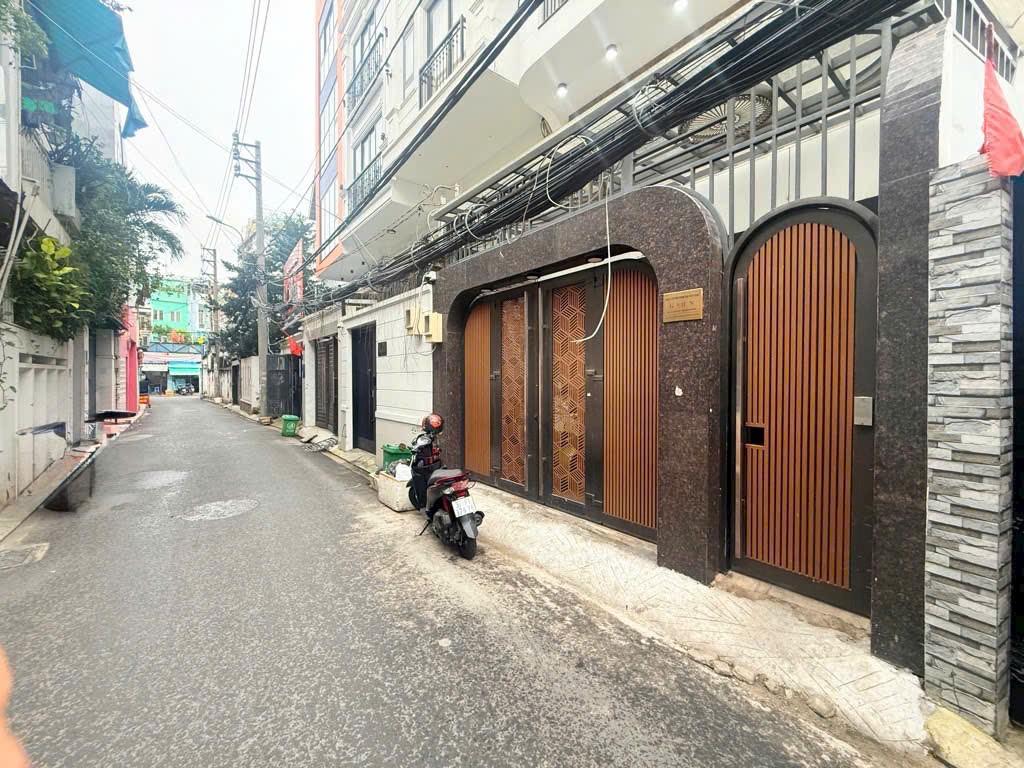  Bán nhà HXH Trần Bình Trọng, 5x18m NH 8m, 8 tấm, 13pn, 13wc, 23.99 tỷ, TL 