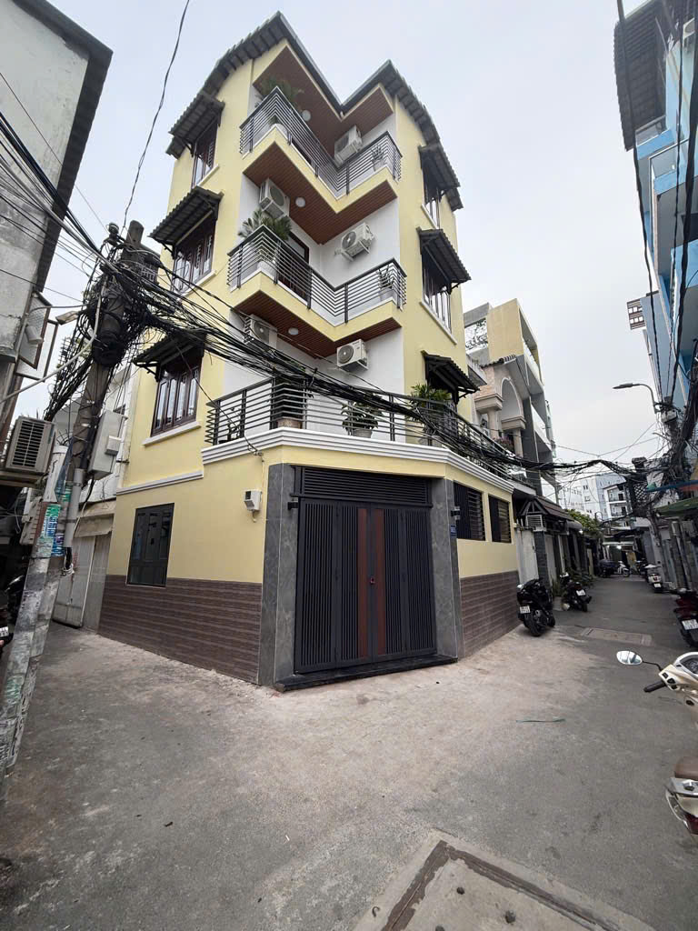  NHÀ GÓC 2 MẶT HẺM 6M XE HƠI QUAY ĐẦU - 9 ty 6 